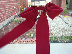Simple Holiday Bow on an outdoor candleholder
